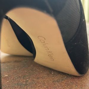 Calvin Klein black and gold lace up heels.